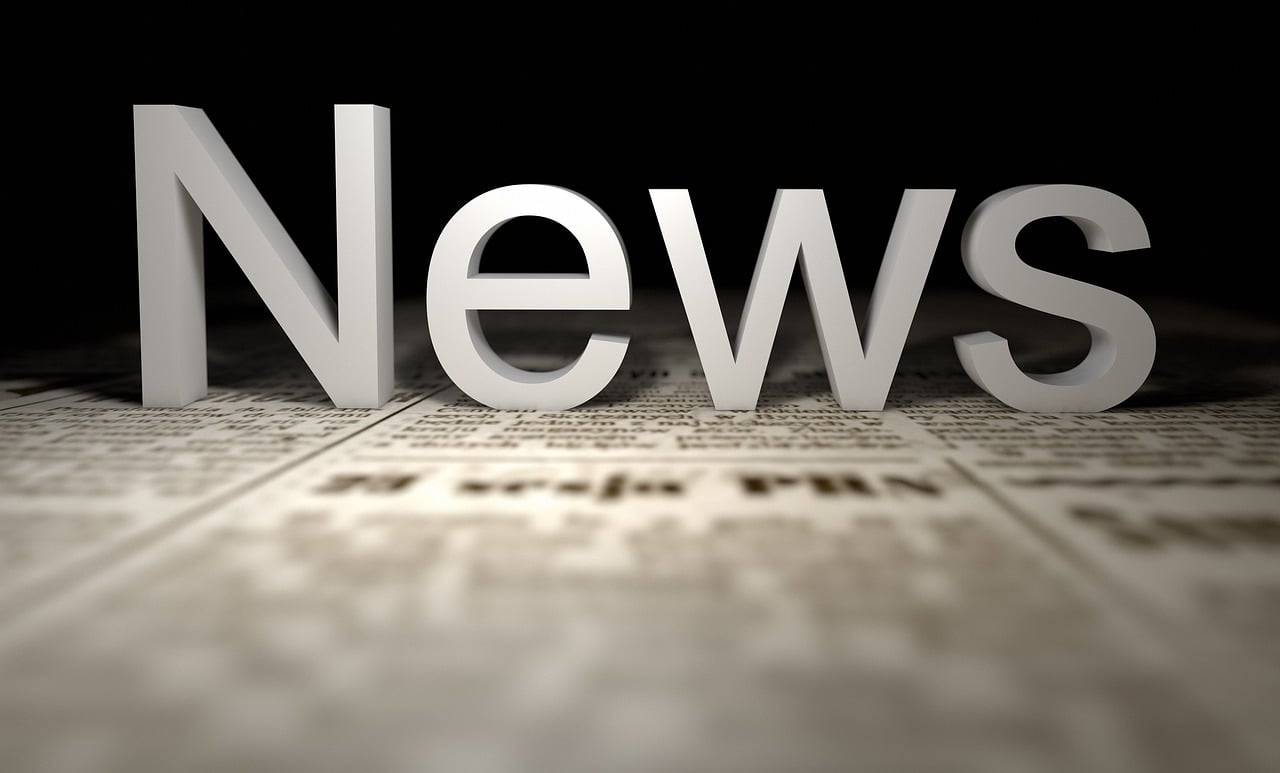 The word "news" in 3D, set against a textured newspaper backdrop.